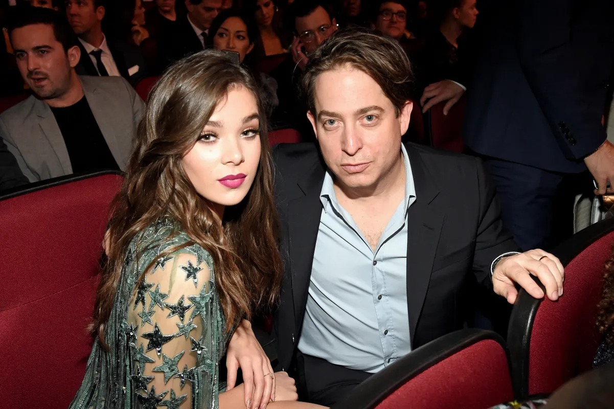 Man and woman seated together in a theater audience