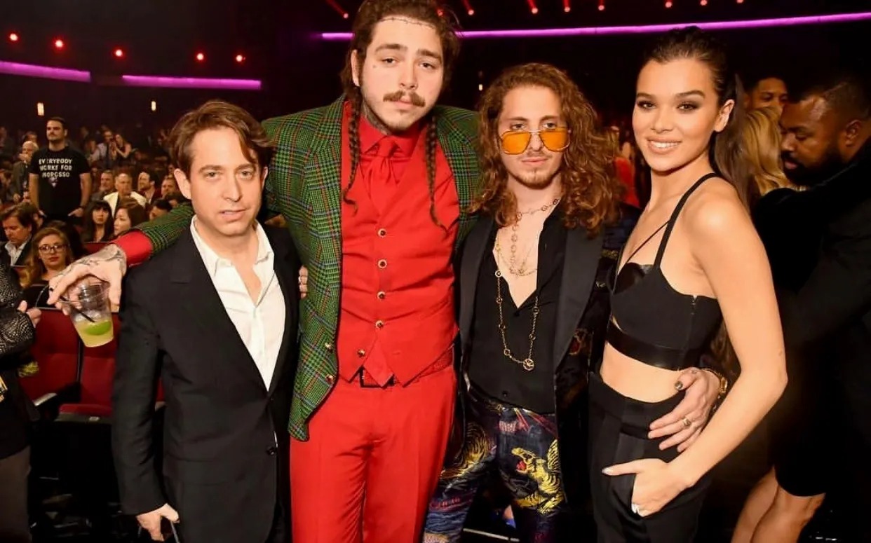 Group of four posing together at an awards show