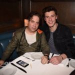 Two men sitting in a restaurant booth