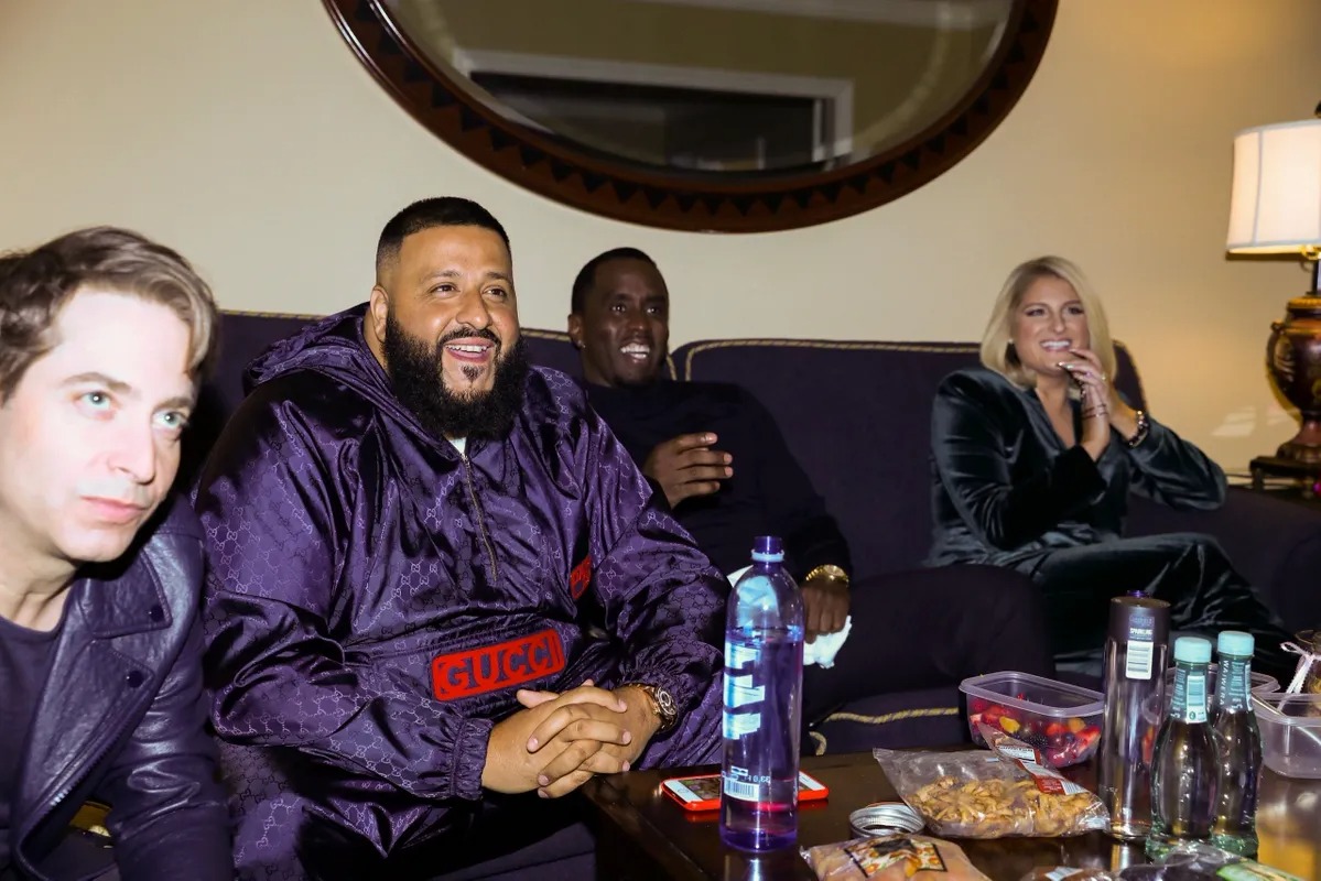 Judges watching a monitor together in a green room
