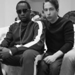 Black and white photo of two men seated side by side