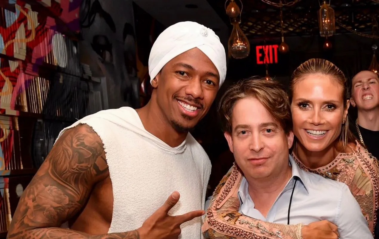 Group of three smiling at a nightclub party