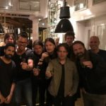 Large group of friends posing in a restaurant