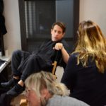 Man relaxing in a dressing room chair before a show