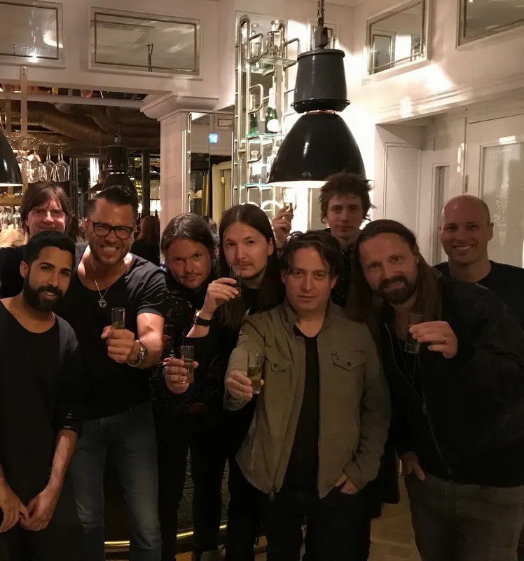 Group of friends raising their glasses in a restaurant