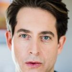 Close-up portrait of a man with dark hair