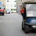 Golf cart driving through a studio backlot