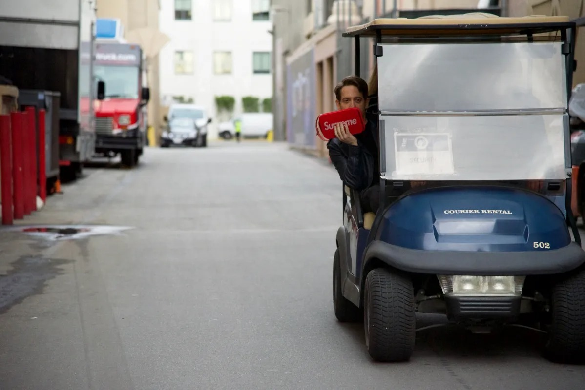 Golf cart driving through a studio backlot