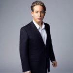Studio portrait of a man in a dark suit